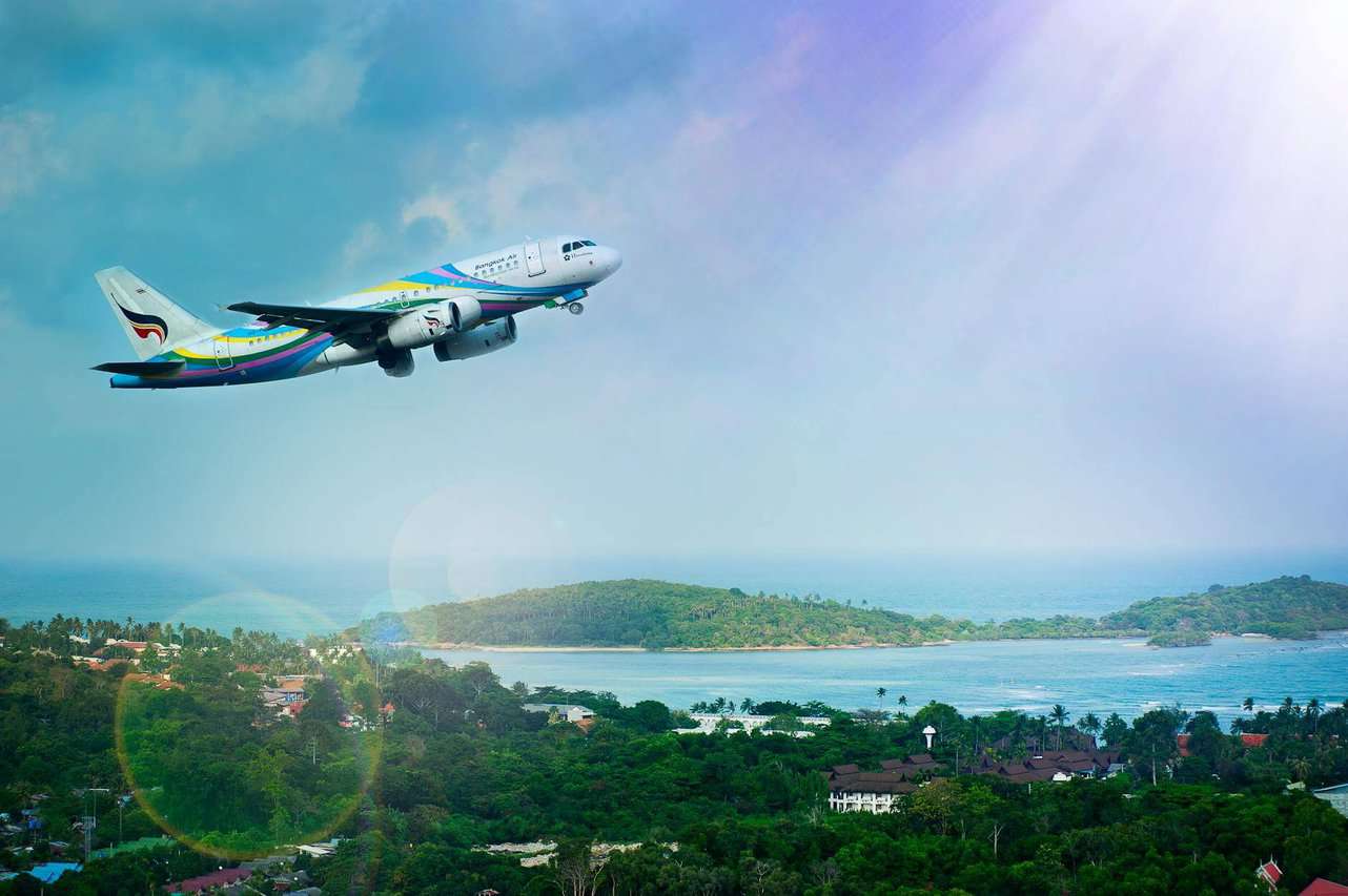 white and blue passenger airplane aerial photography