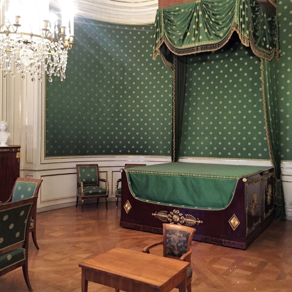 Green Bed with Green wall paper inside of Schloss Nymphenburg