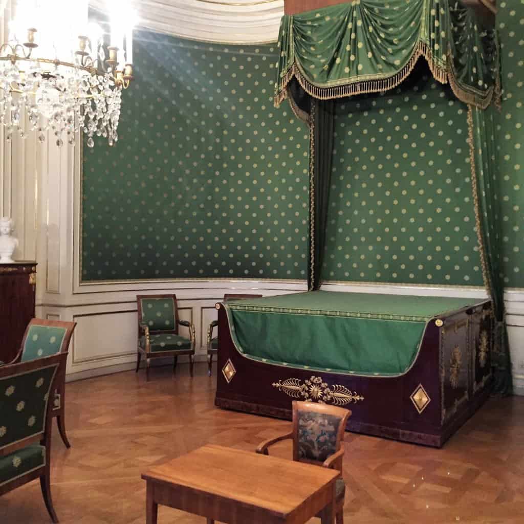 Green Bed with Green wall paper inside of Schloss Nymphenburg