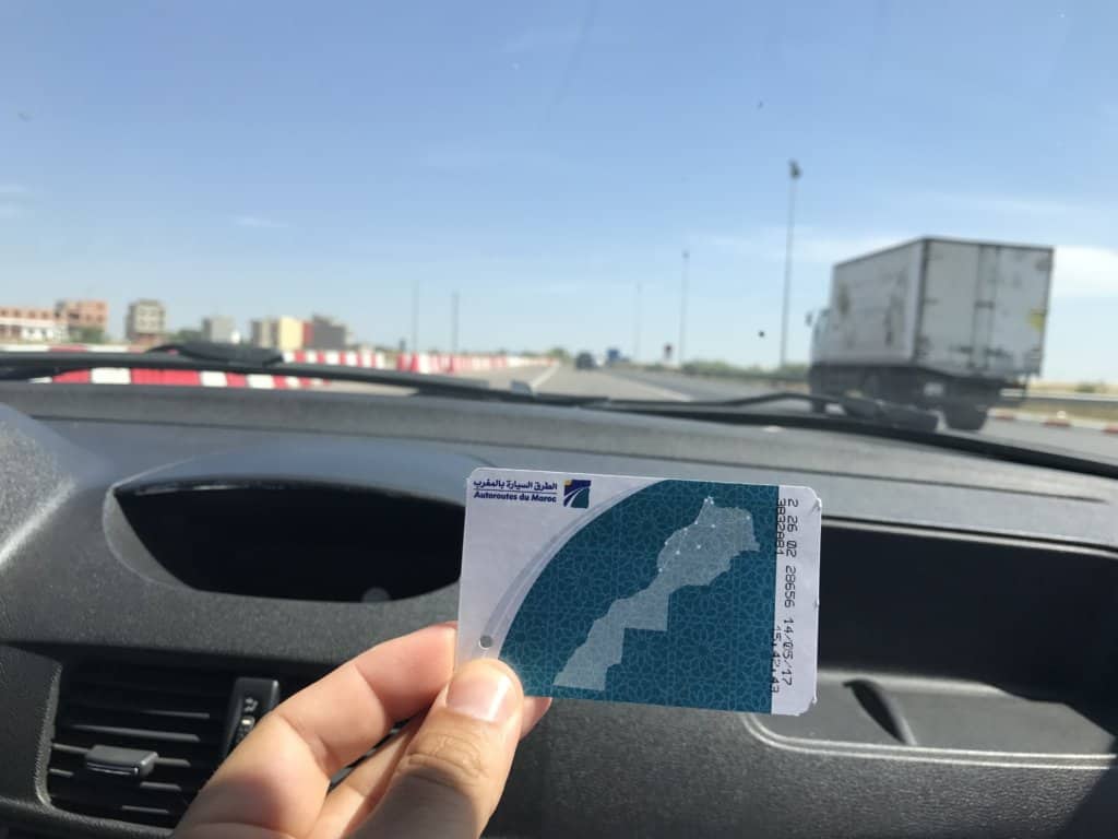 Car Windshield and a toll ticket while renting a car in Morocco