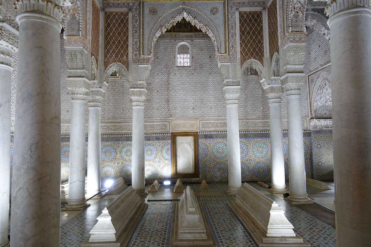 Saadian Tombs in Marrakech Ornate interior of the Saadian Tombs in Marrakech featuring marble columns and intricately tiled walls.