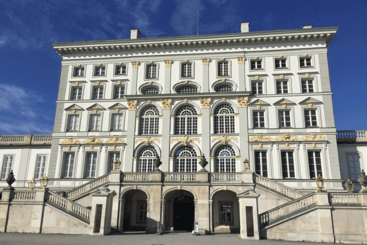 Exterior of Schloss Nymphenburg, a white and green German building