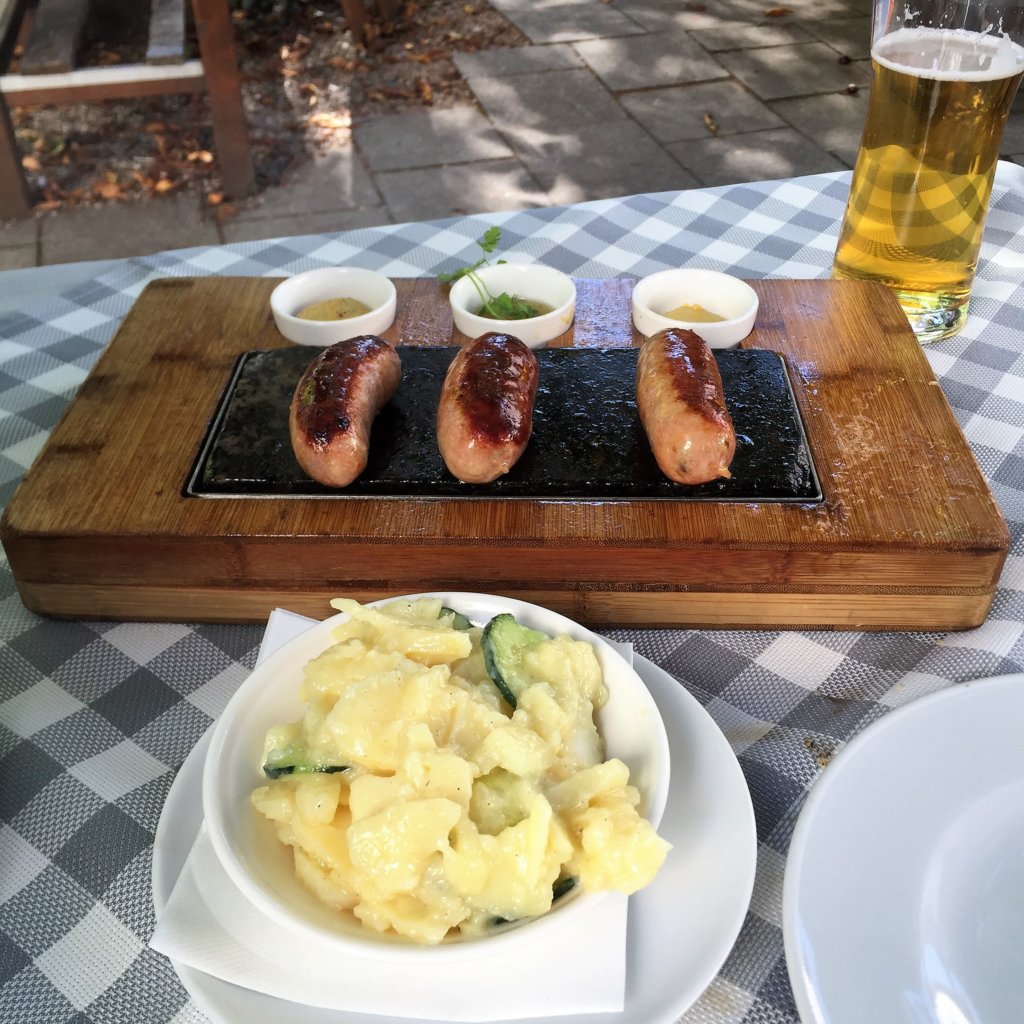German Sausages, Potato Salad and Tall Beer 