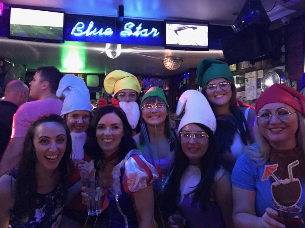 Woman dressed up as snow white and the seven dwarfs
