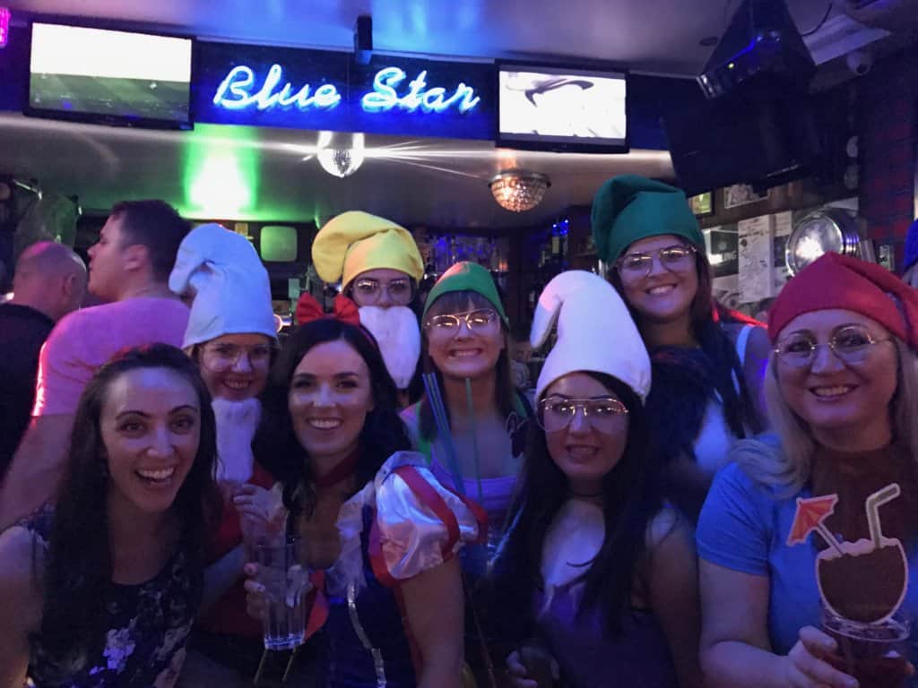 Woman dressed up as snow white and the seven dwarfs