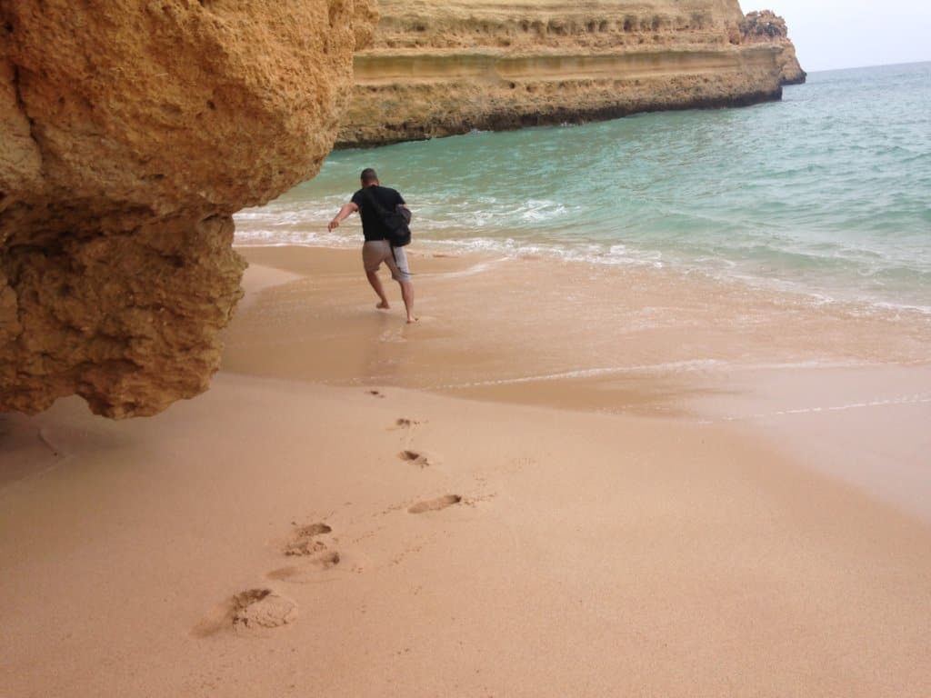 Man running away from a wave