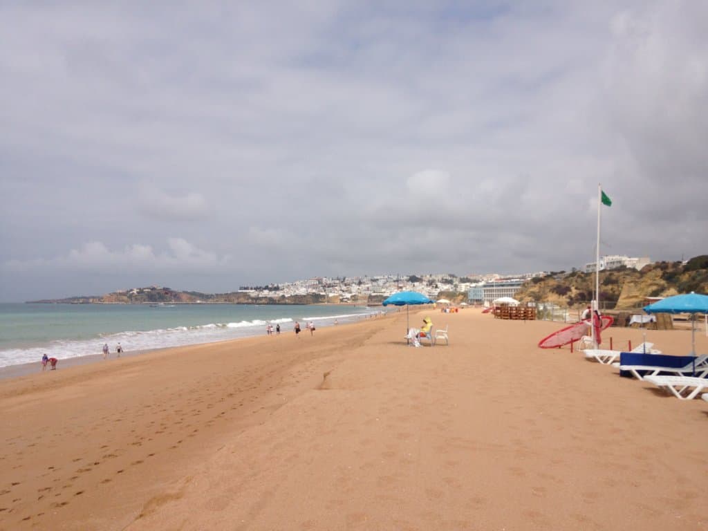 Beach and cliffs in background in the Algarve region