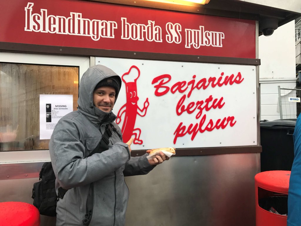 Man holding a lamb hot dog in Iceland