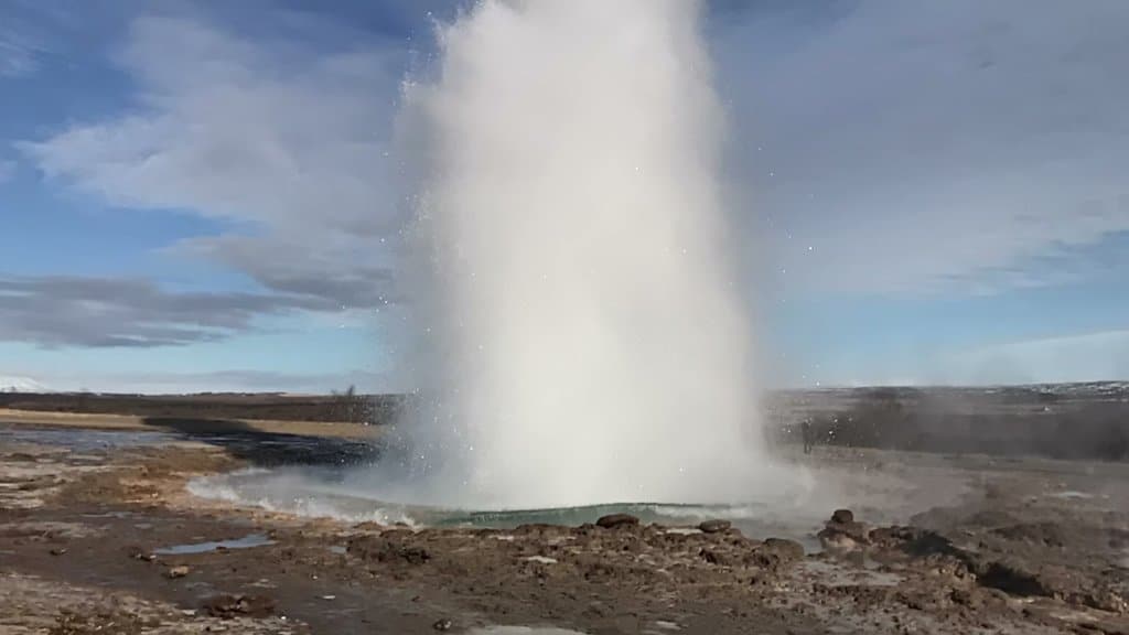 Large Geysir shooting water into the air 