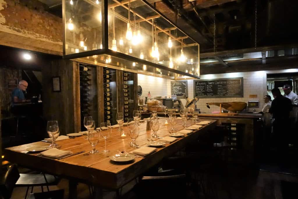 Long table with glasses inside of the Tavern 