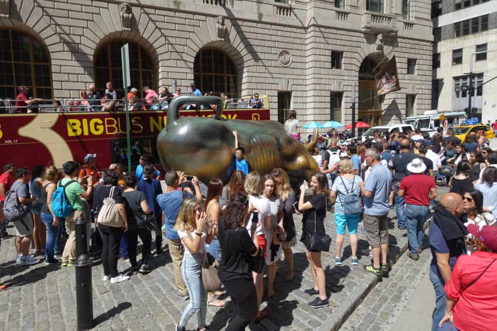 The Charging Bull mobbed by people in the financial district