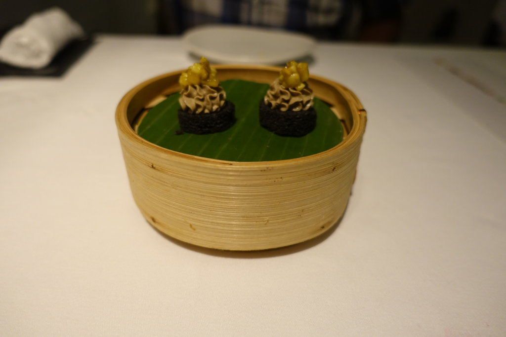 Small appetizers served in a bamboo bowl