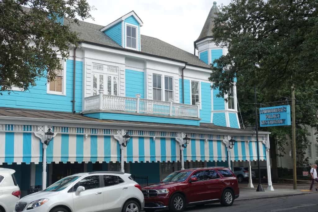 Outside of Commanders Palace blue and white awning 