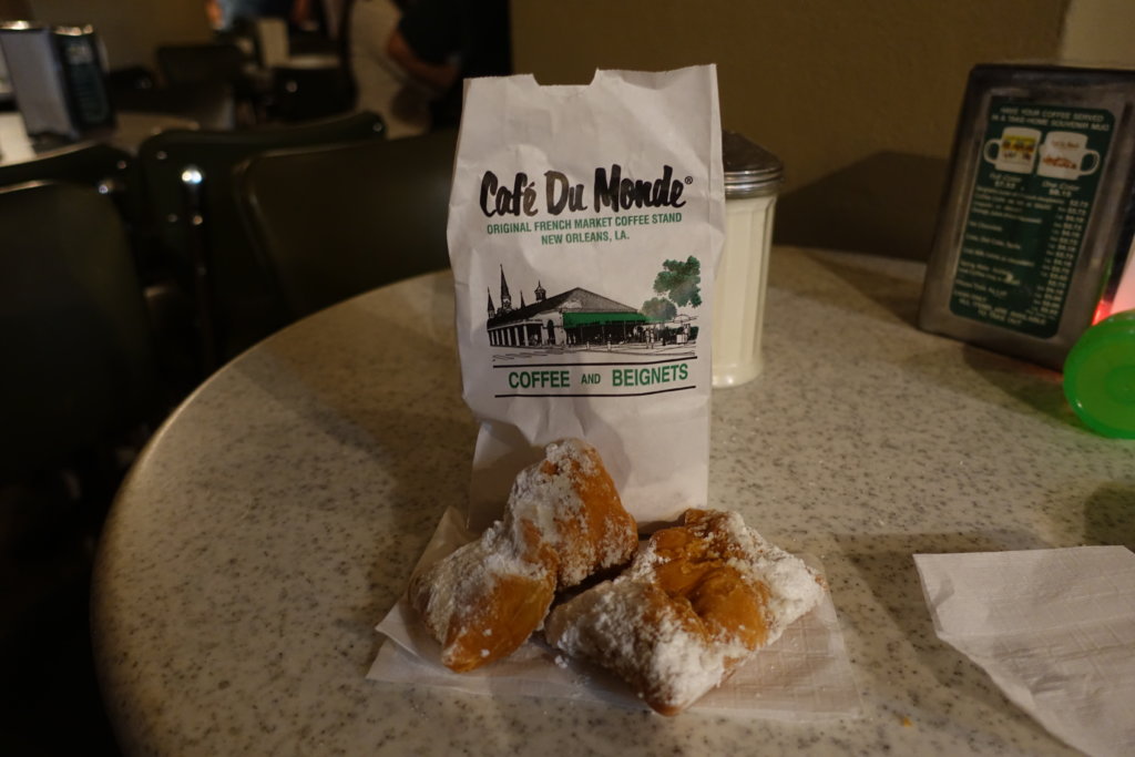 3 Beignets and a paper bag
