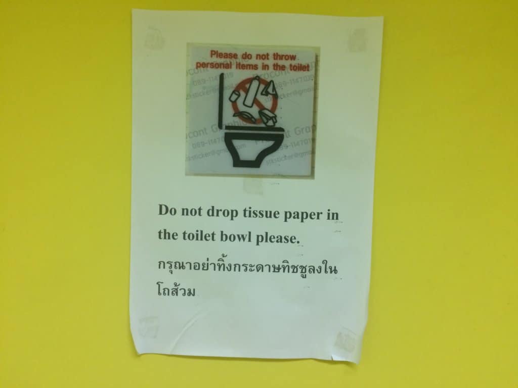 Sign saying to not throw anything in the toilet