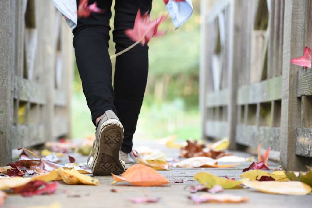 Person walking on bridge trying to lose weight eating thai food