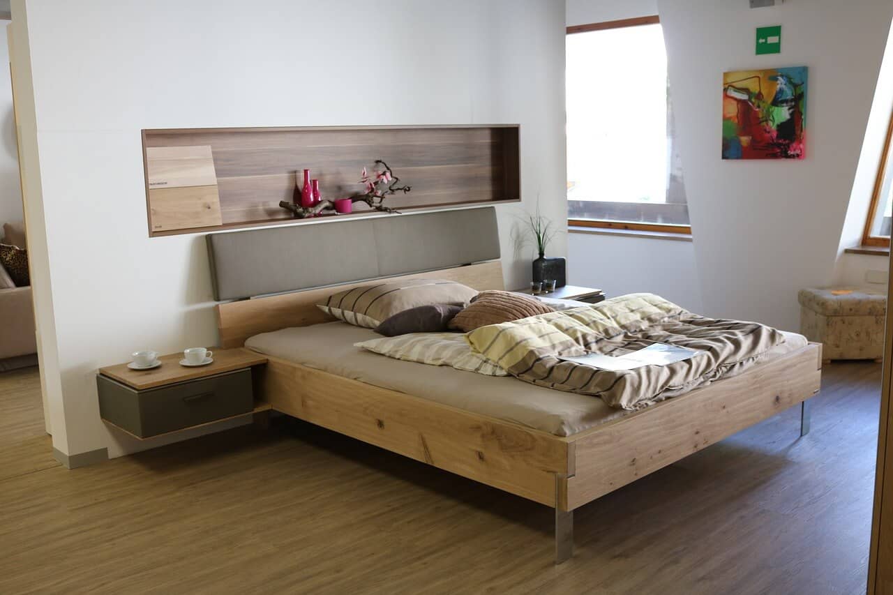 wooden bed inside of an airbnb