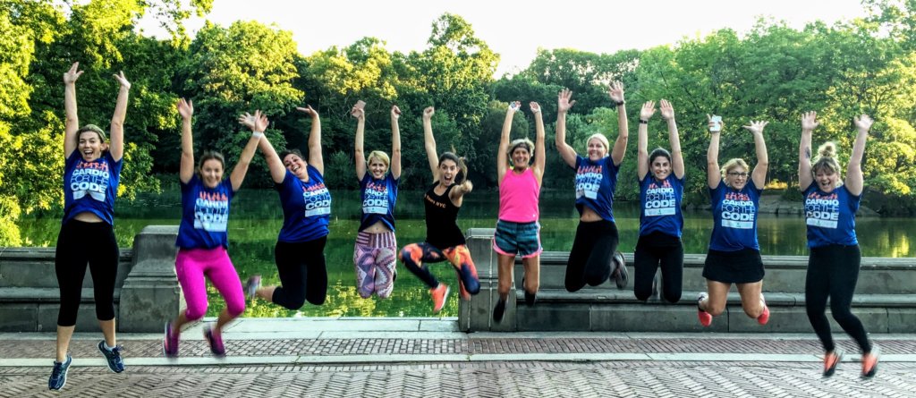 Ten people jumping in the air in central park on the best running tour in new york city