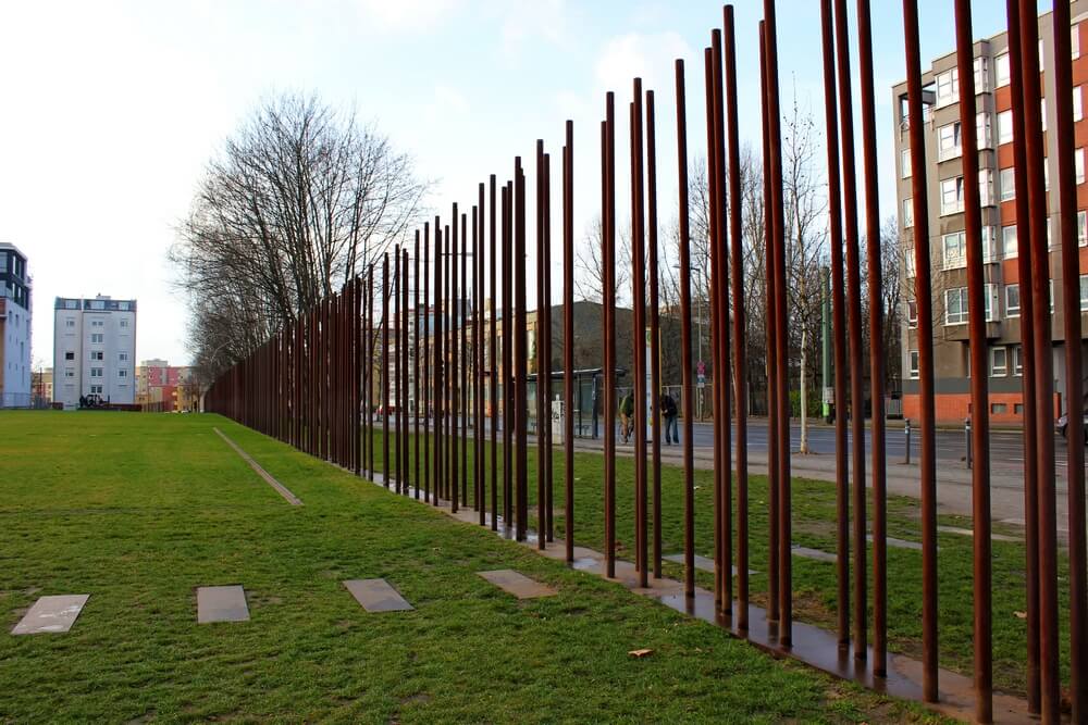 A wall of poles from the Bernauer Memorial Wall
