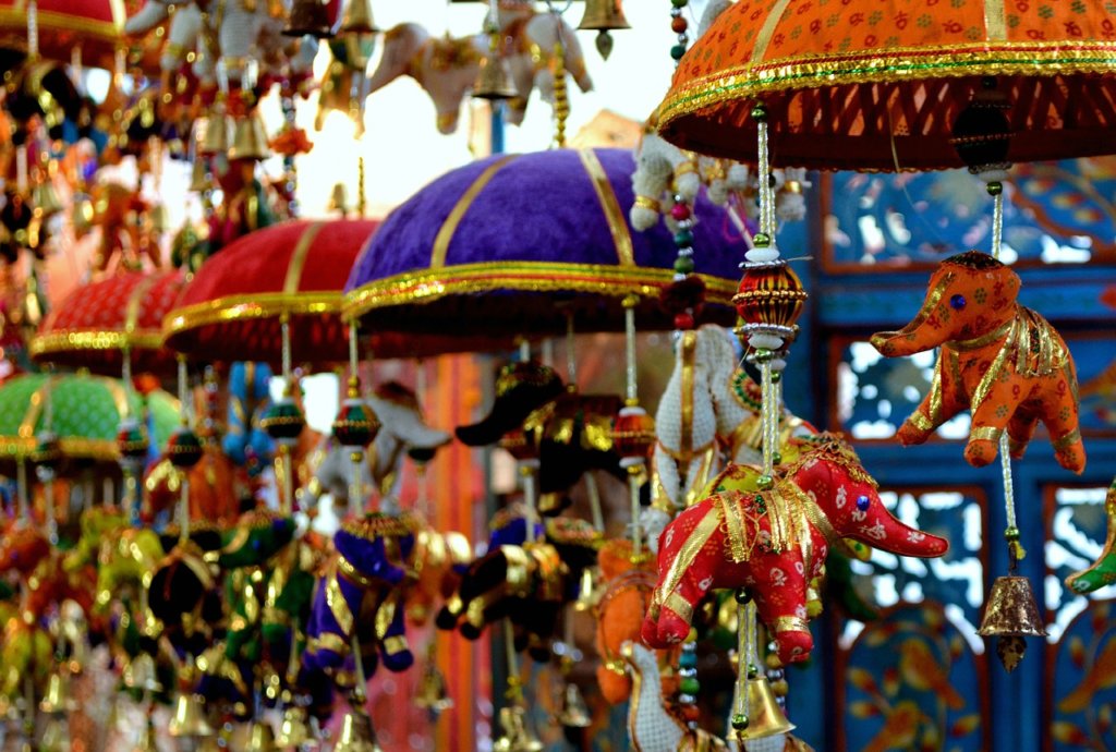 Toys hanging in a market in singapore making it not the most boring city in the world