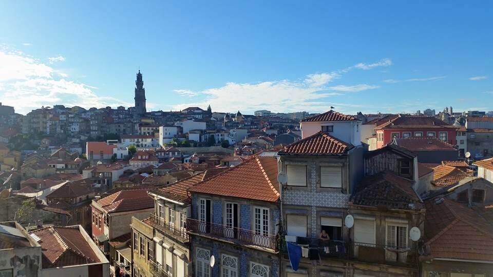 Skyline of Porto Portugal, blue skies and orange roofs as one of the best day trips from lisbon 