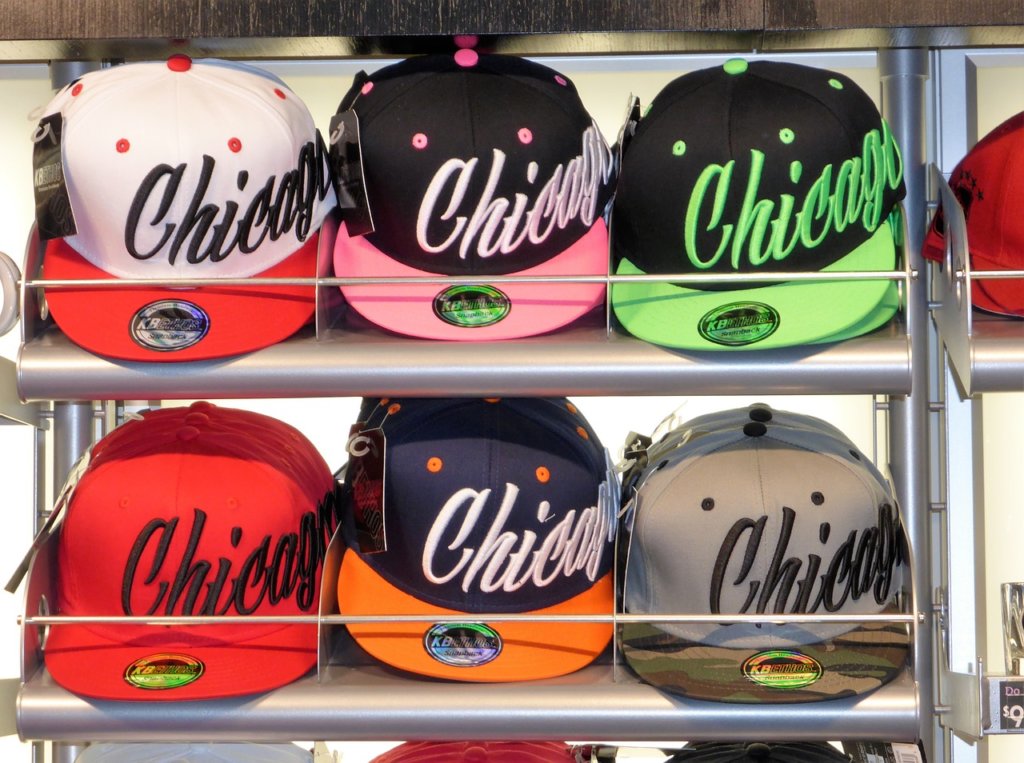 Two racks of hats that say Chicago on them 