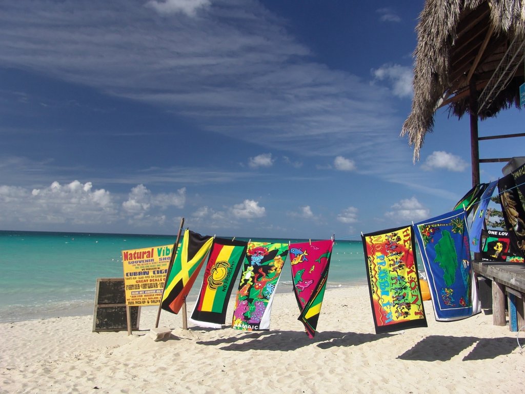A beach in Jamaica with flags flying