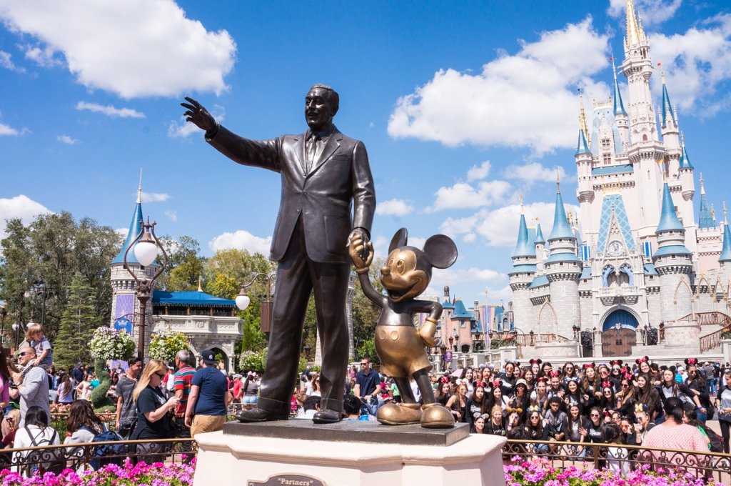 A statue of walt disney and mickey mouse in Orlando Florida, one of the fab spots in Florida 