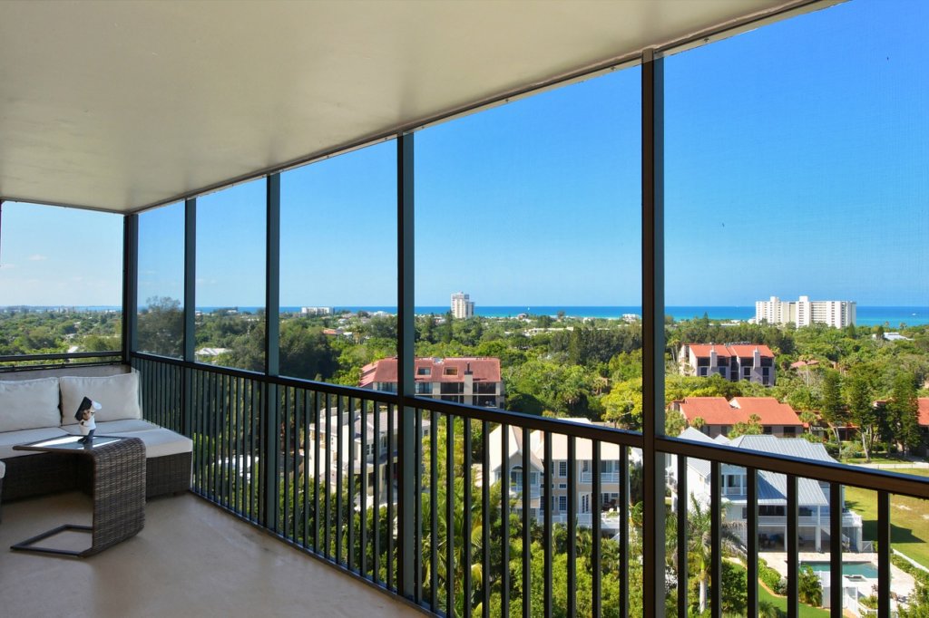 A hotel blacony overlooking a beach in Sarasota florida