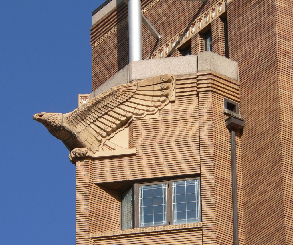 A beige brick building with an eagle on it in Iowa