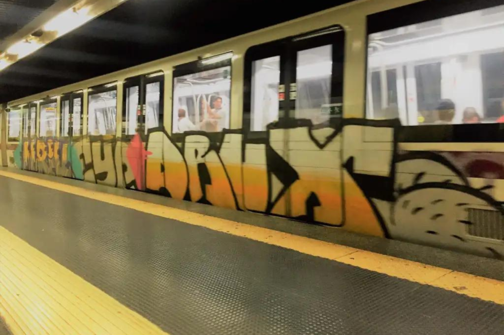 Metro train covered in graffiti in Rome