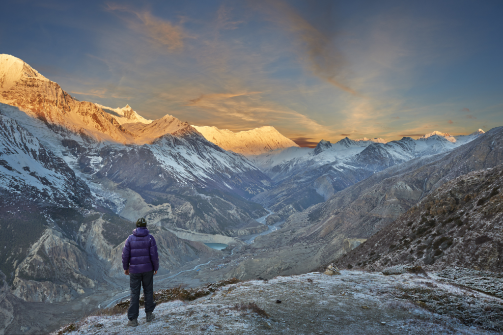 Man looking out at the Himalayan Mountain Terrain