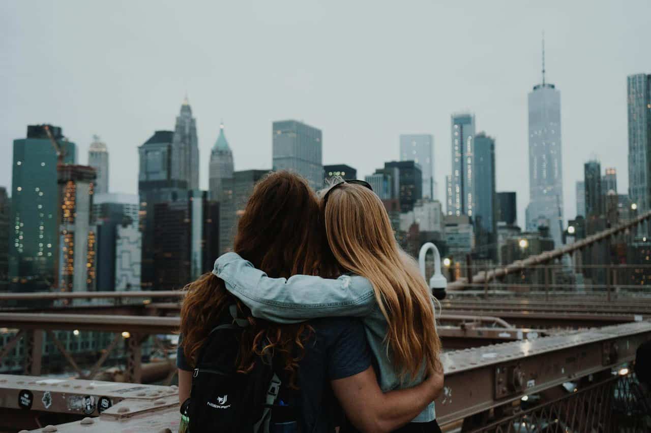 a couple enjoying the view of the new york city skyline deciding which fun NYC tour to take 