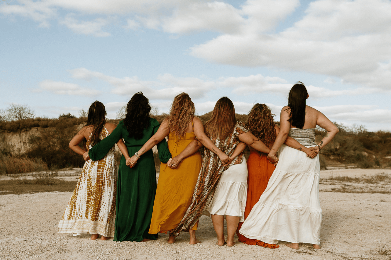 Group of woman holding hands behind their backs on one of the female-focused wellness tours