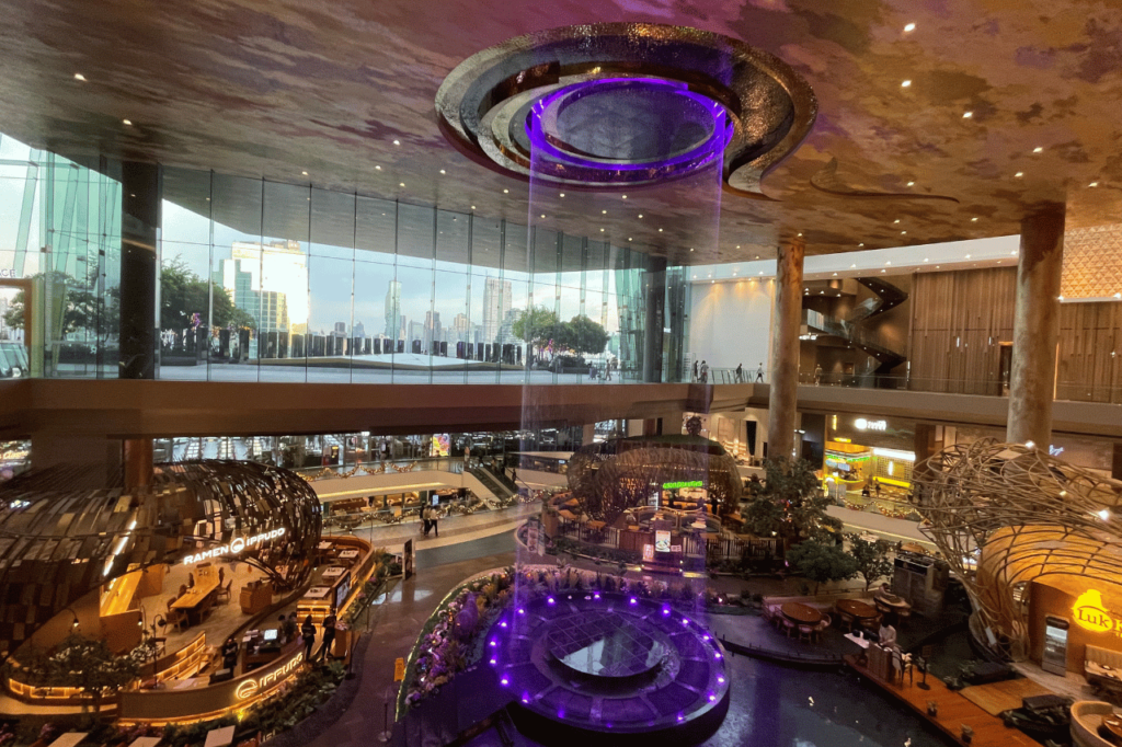purple light water show inside of a bangkok mall