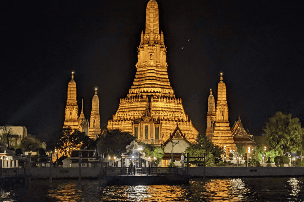 wat arun temple lit up at night