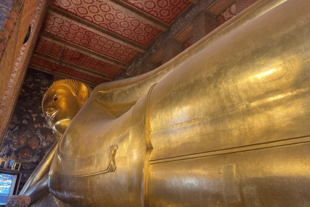 large gold buddha laying down at wat pho