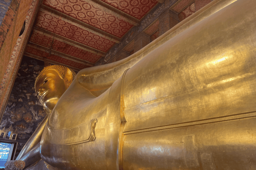 large gold buddha laying down at wat pho