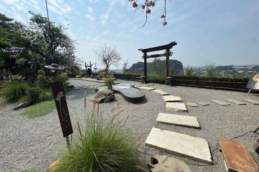 Stone pathway in a peaceful zen garden overlooking Marble Mountains Vietnam