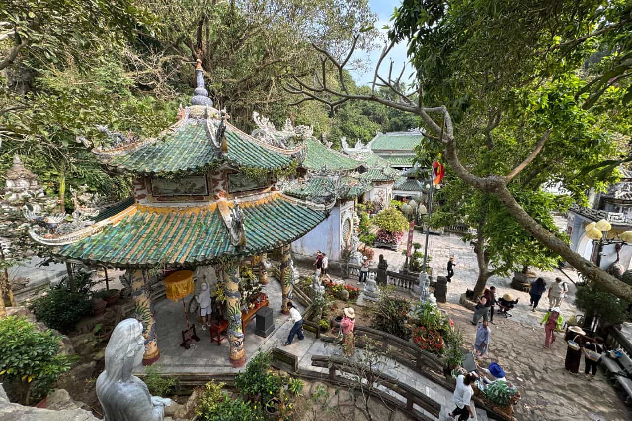 Linh Ung Pagoda Courtyard – Marble Mountains Vietnam Ornate pagoda and temple courtyard surrounded by lush greenery at Marble Mountains Vietnam