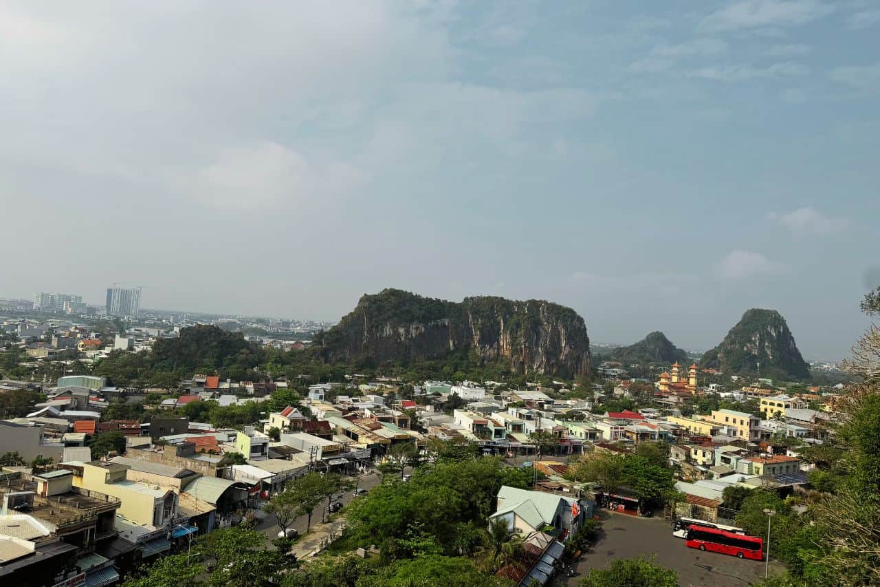 Aerial View of Marble Mountains and Da Nang City Panoramic cityscape with Marble Mountains rising amid urban surroundings in Da Nang, Vietnam