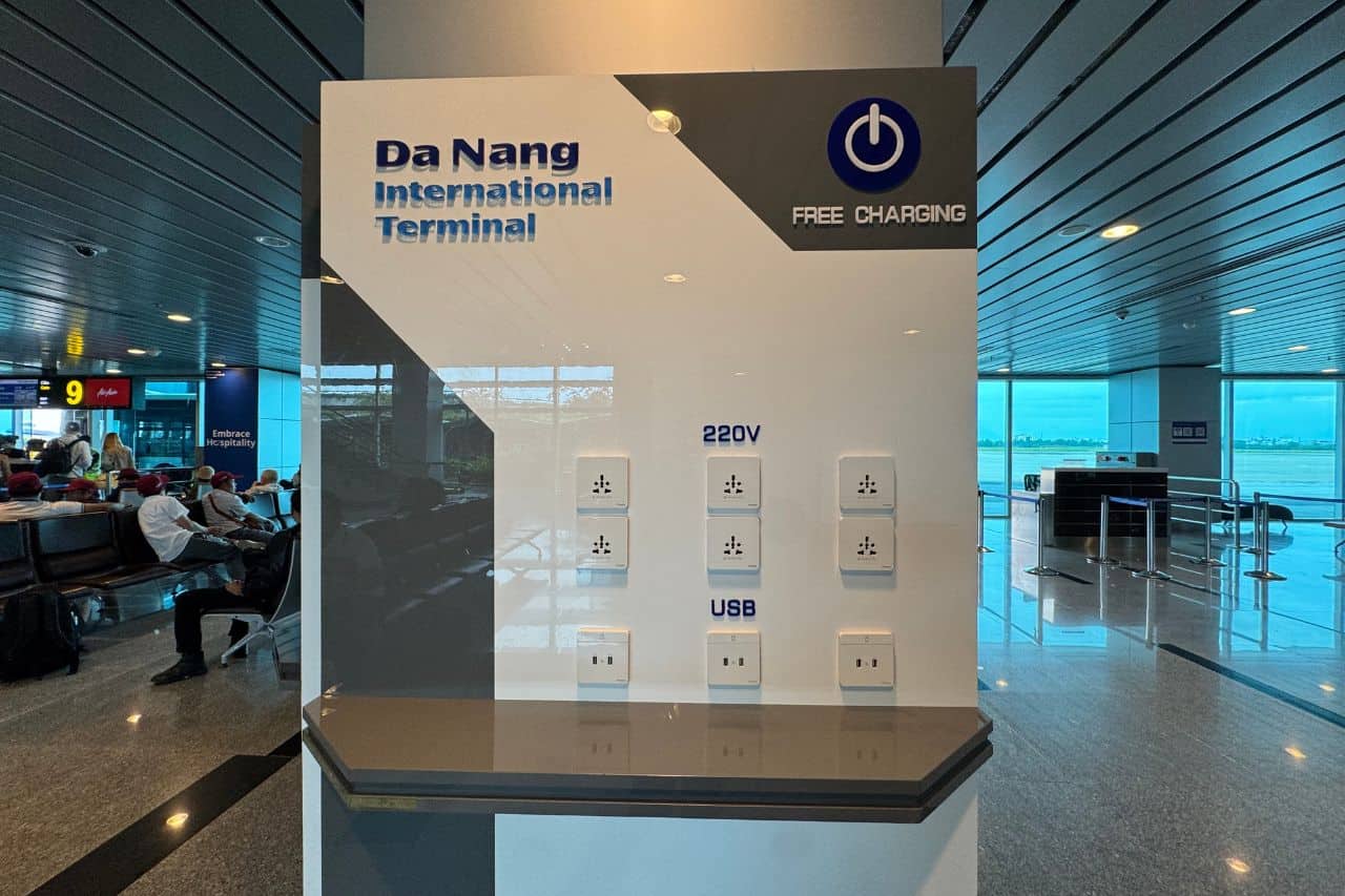 Free Charging Station - Da Nang Airport Convenience Free charging station at Da Nang Airport featuring 220V and USB outlets near international gates