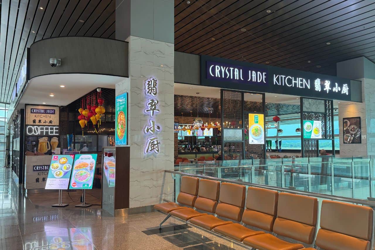 Crystal Jade Kitchen - Dining at Da Nang Airport Exterior of Crystal Jade Kitchen at Da Nang Airport with menu boards, lanterns, and indoor seating visible
