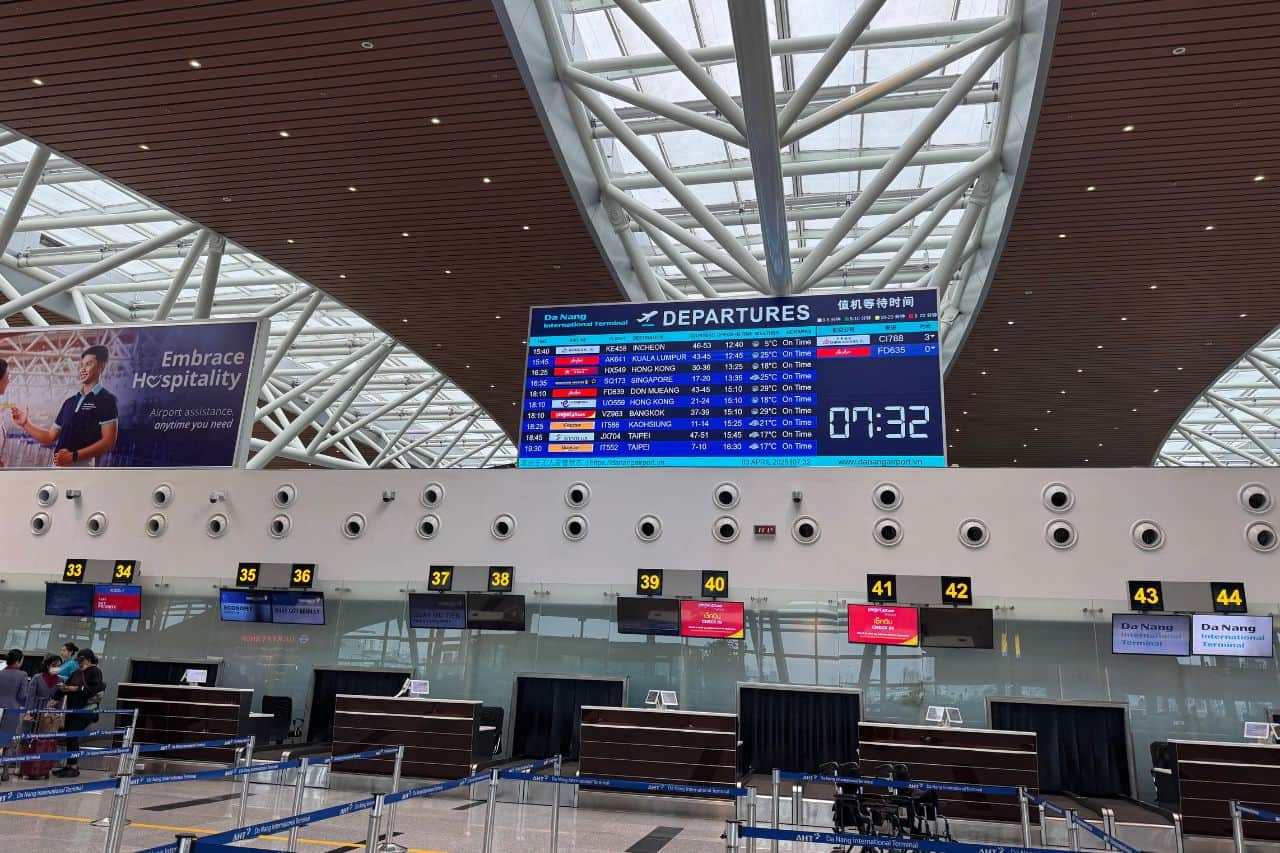 Departures Hall - Da Nang Airport Check-In Area Modern architecture and clear signage in the departures area at Da Nang Airport with check-in lines and glass partitions