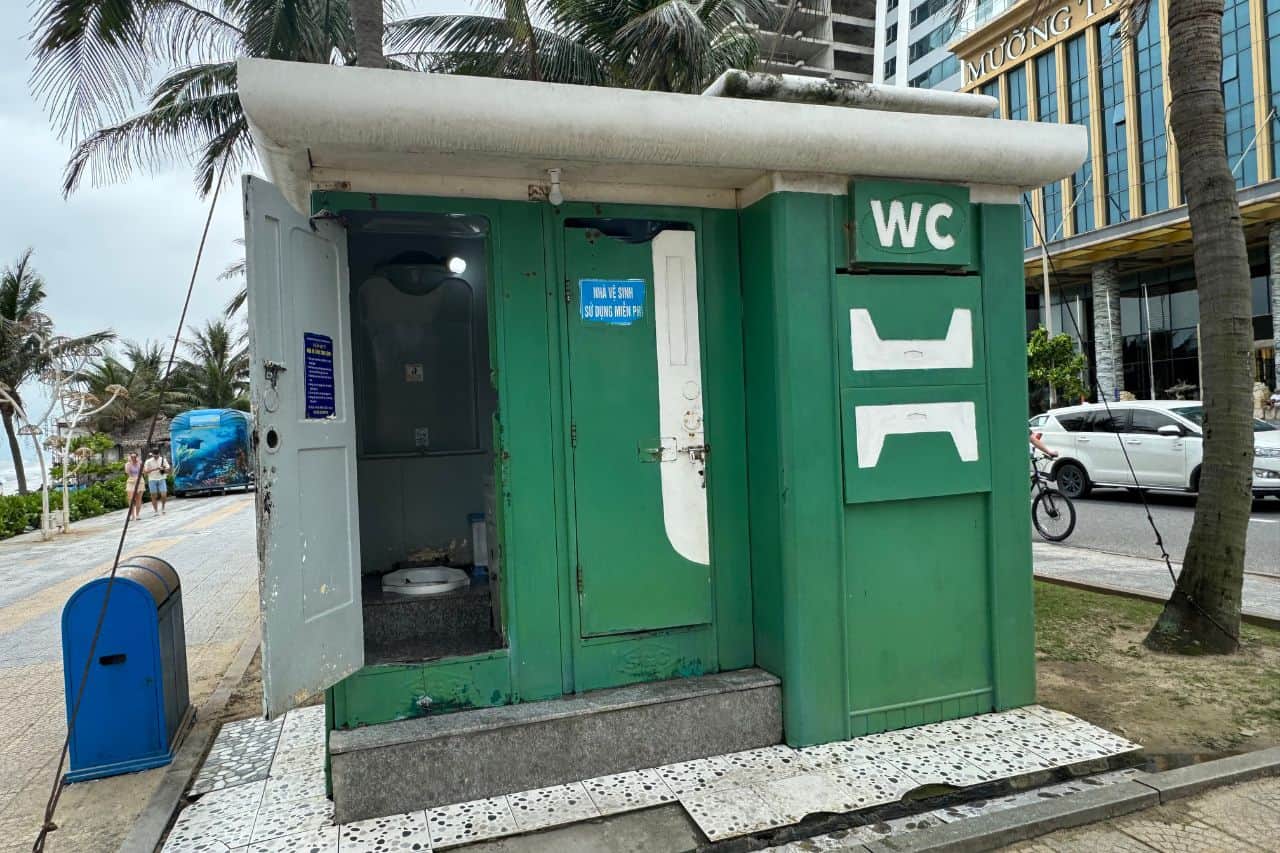 Public restroom near My Khe Da Nang Beach with green painted exterior