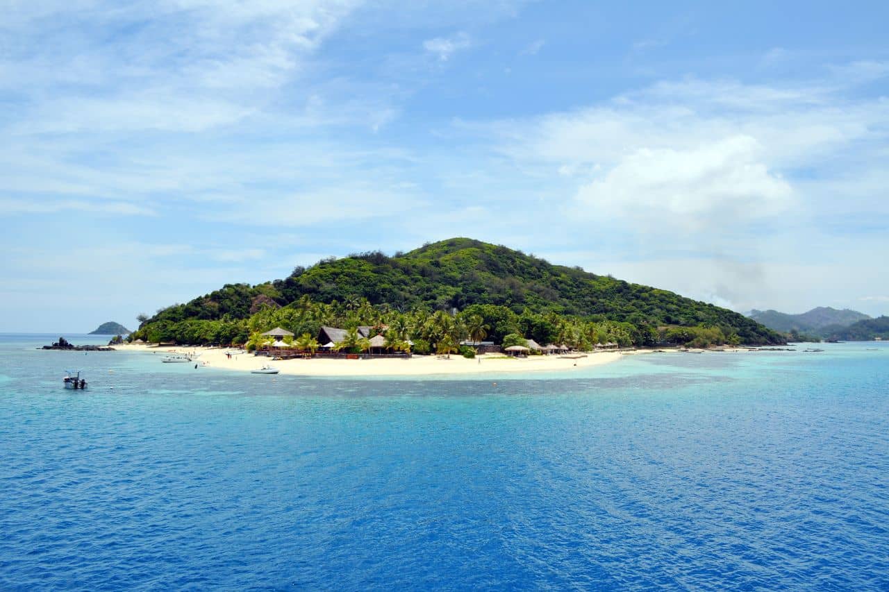 Discover the Stunning Gili Islands Tropical island in the Gili Islands surrounded by turquoise waters and sandy beaches.