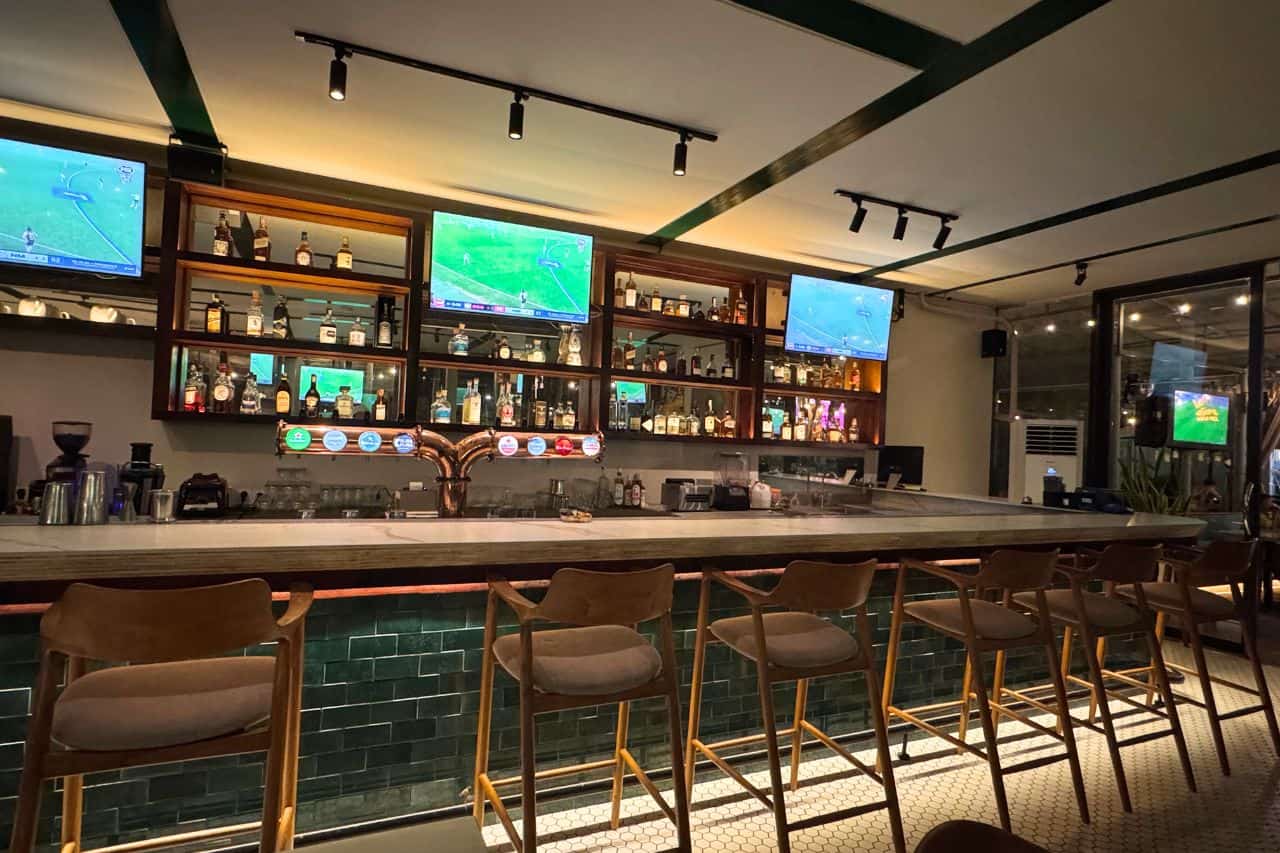 Empty modern bar in Canggu with flat screen TVs and beer taps