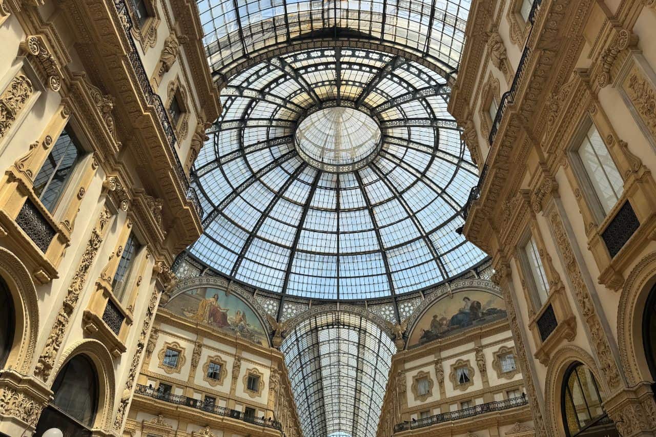 Glass Dome of Galleria Vittorio Emanuele II in Milan Ornate glass dome ceiling with historic architecture inside Galleria Vittorio Emanuele II shopping arcade in Milan, Italy