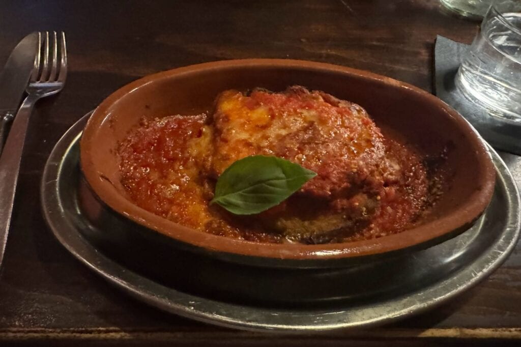 Plate of authentic Lucchese lasagna with rich tomato sauce and melted cheese