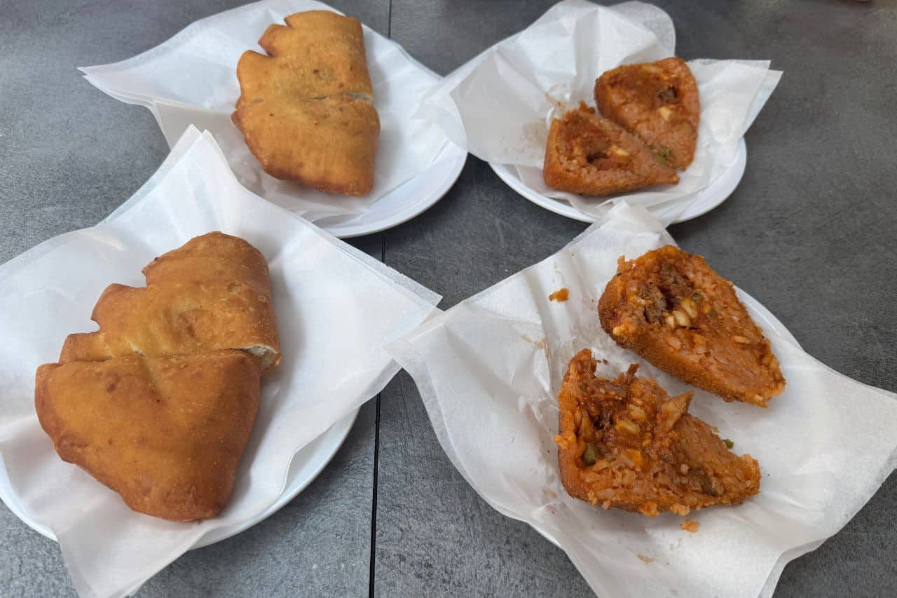 Try arancini in Catania, a classic Sicilian street food filled with rice, cheese, and flavors you’ll love.